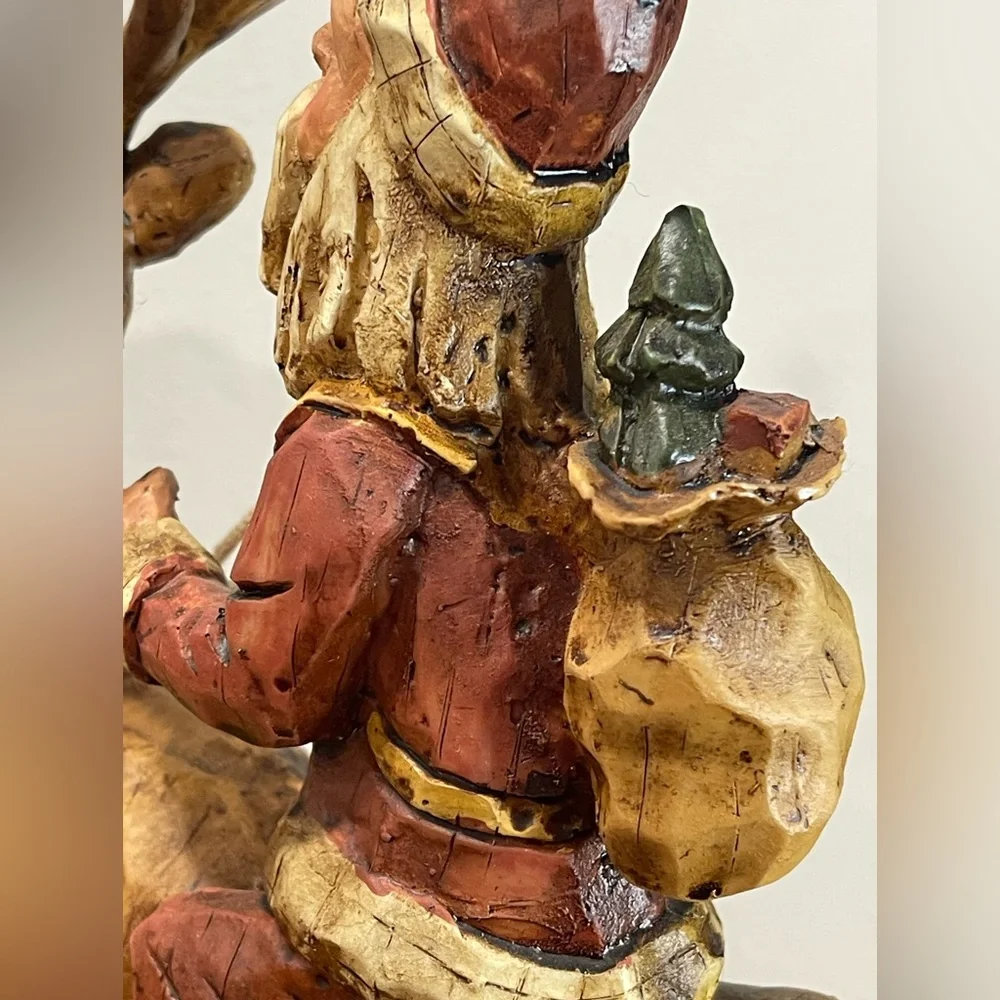 Primitive Folk Art Santa riding Reindeer 12”‎ tall chiseled resin faux wood